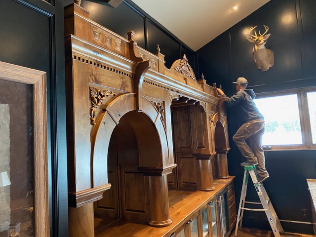 Josh Krueger installing ornate back bar